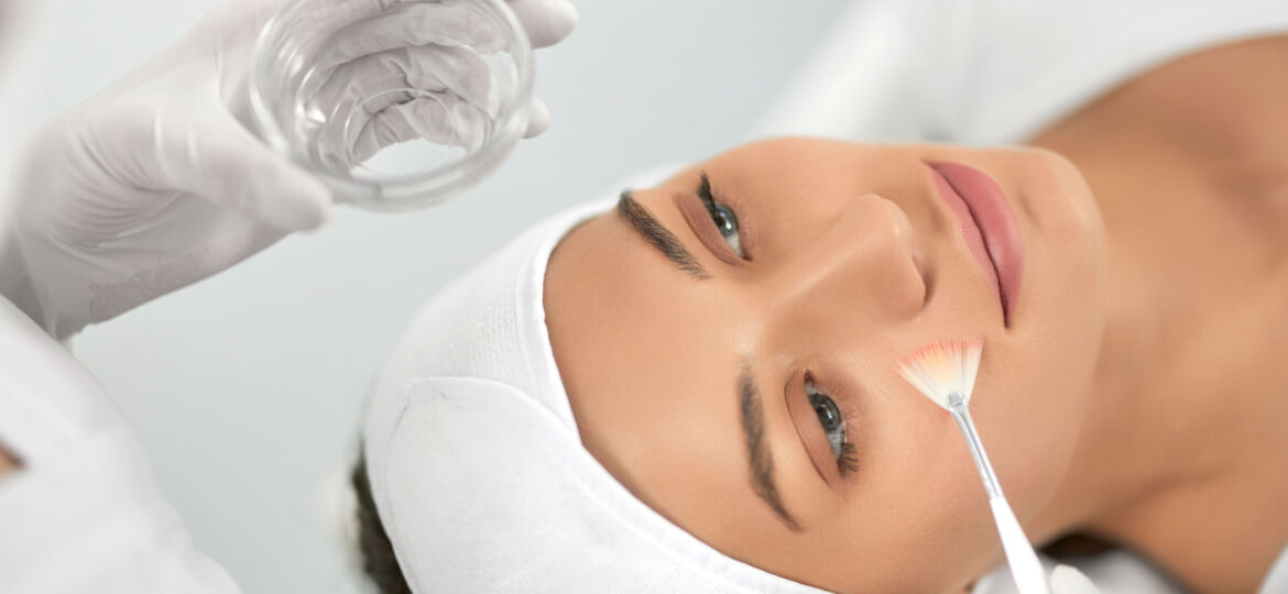 Young woman doing procedure for face in beautician.